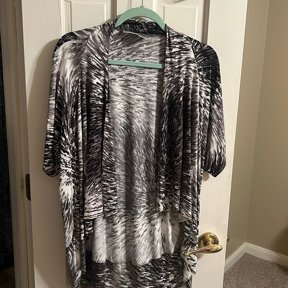 Chico size one black and white top that you wear over a blouse